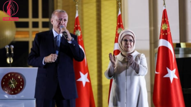 President Erdogan addresses supporters alongside his wife, Ermine Erdogan, at the presidential palace in Ankara. Photograph: Ümit Bektaş/Reuters