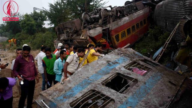 Rescue workers search for survivors after two passenger trains collided in Balasore district in the eastern state of Odisha, India